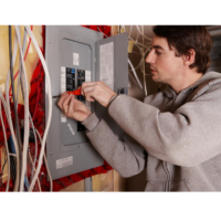 Man wiring an electric panel